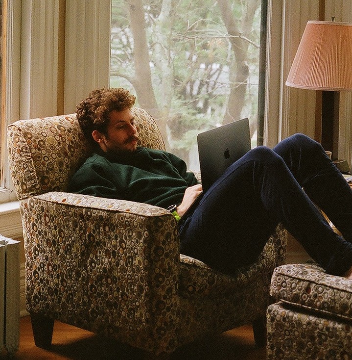 Quigley reading on a chair